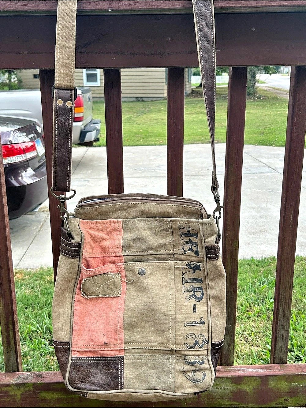 Chloe & Lex canvas and leather-trim crossbody bag featuring a pink color-block
